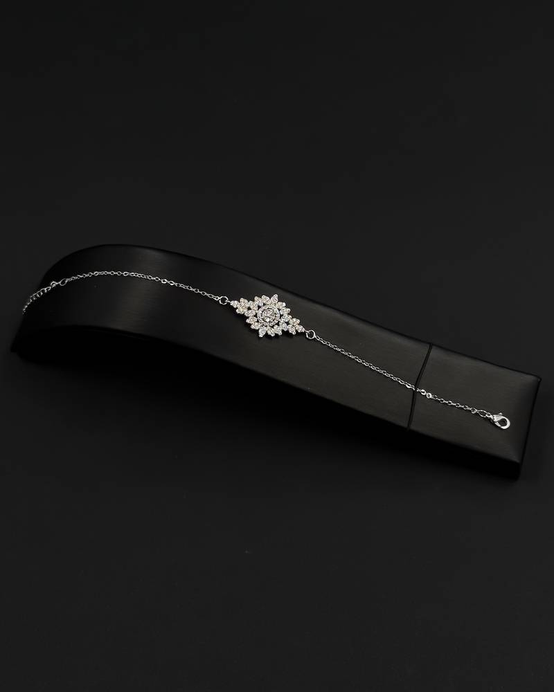 A delicately designed accessory set with a jeweled watch.