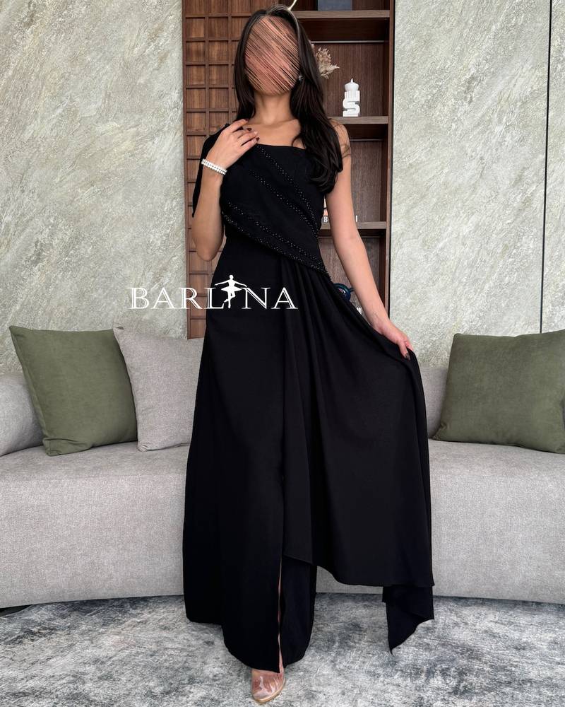 Black off shoulder dress embroidered with stones