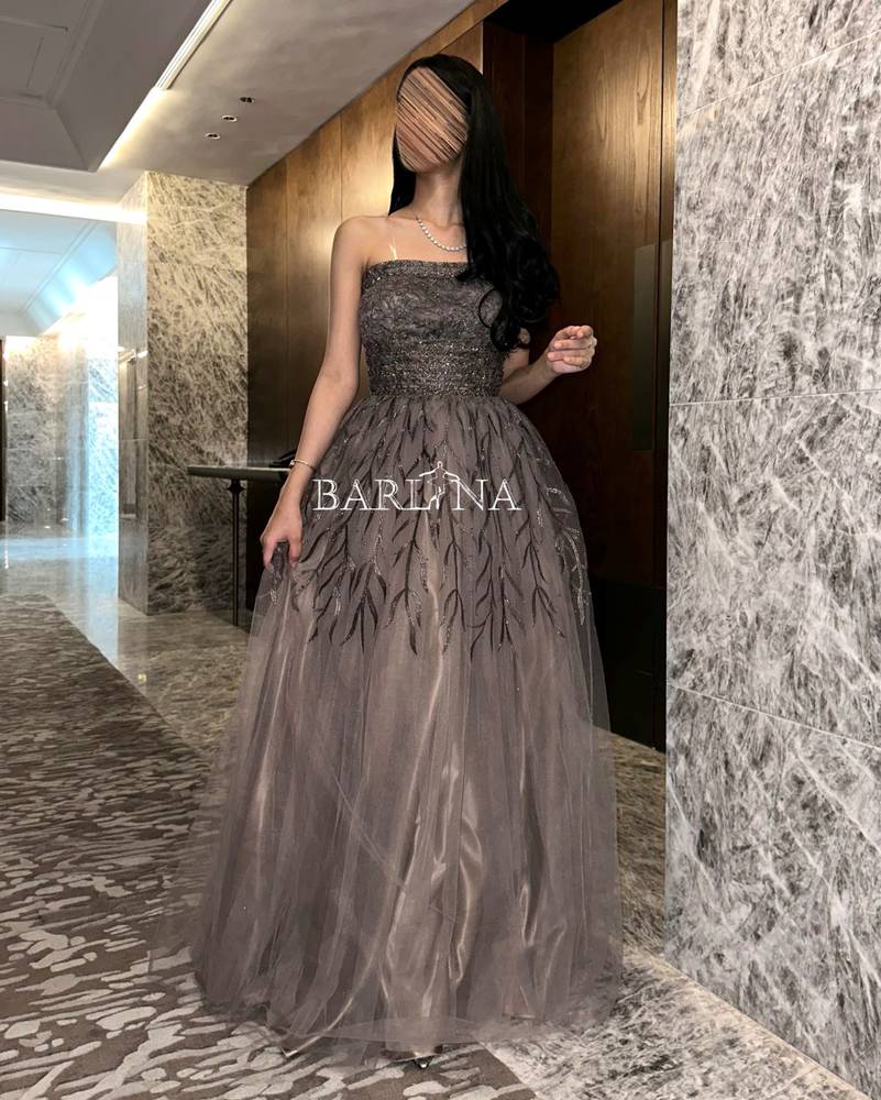 Long dress with embroidered twigs