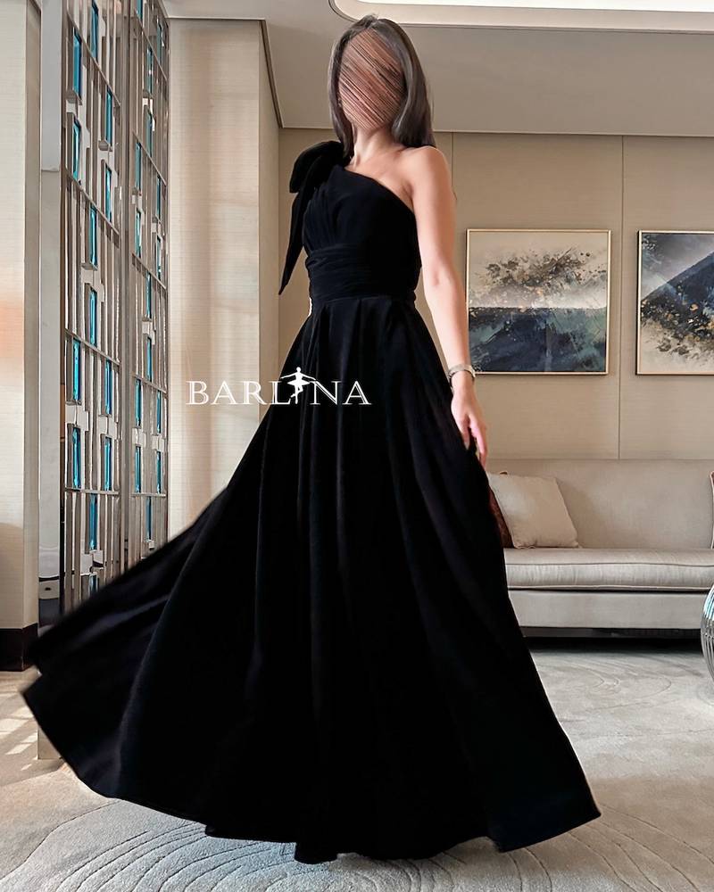 Black velvet dress with bow on the shoulder