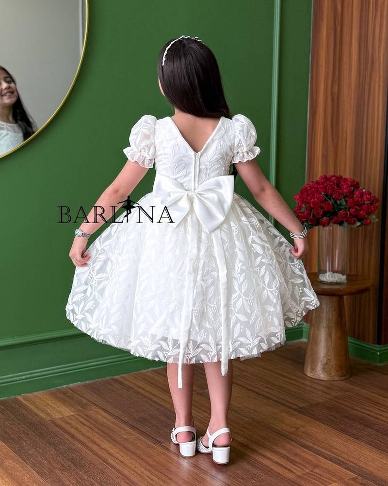 White fluffy girl's dress with delicate embroidery