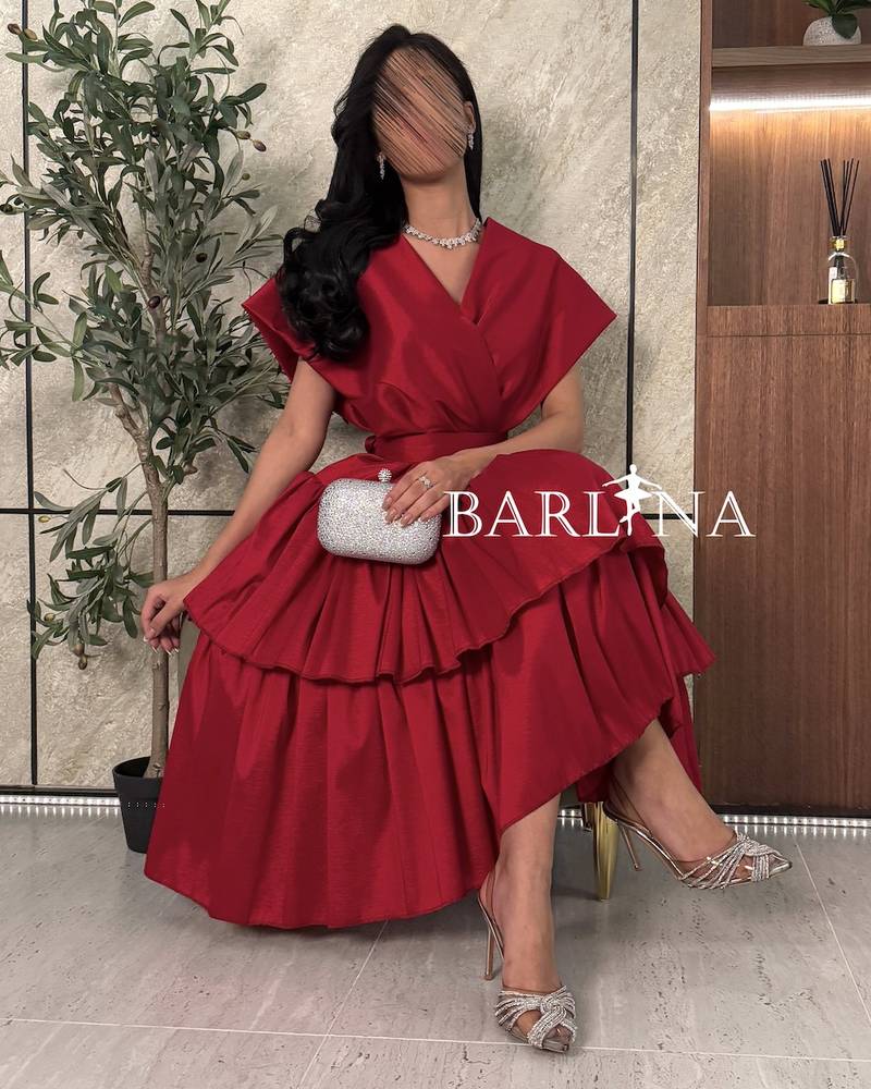 Elegant red layered dress with broad shoulders