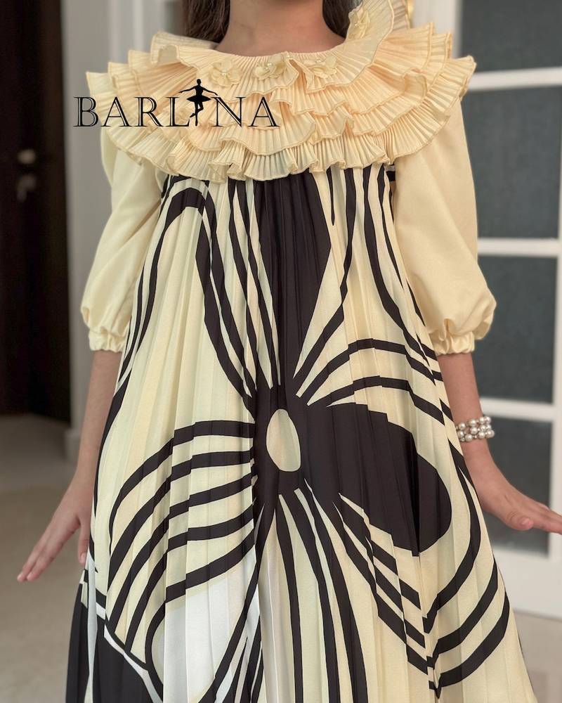 Girls' dress with a ruffled top and a modern pattern