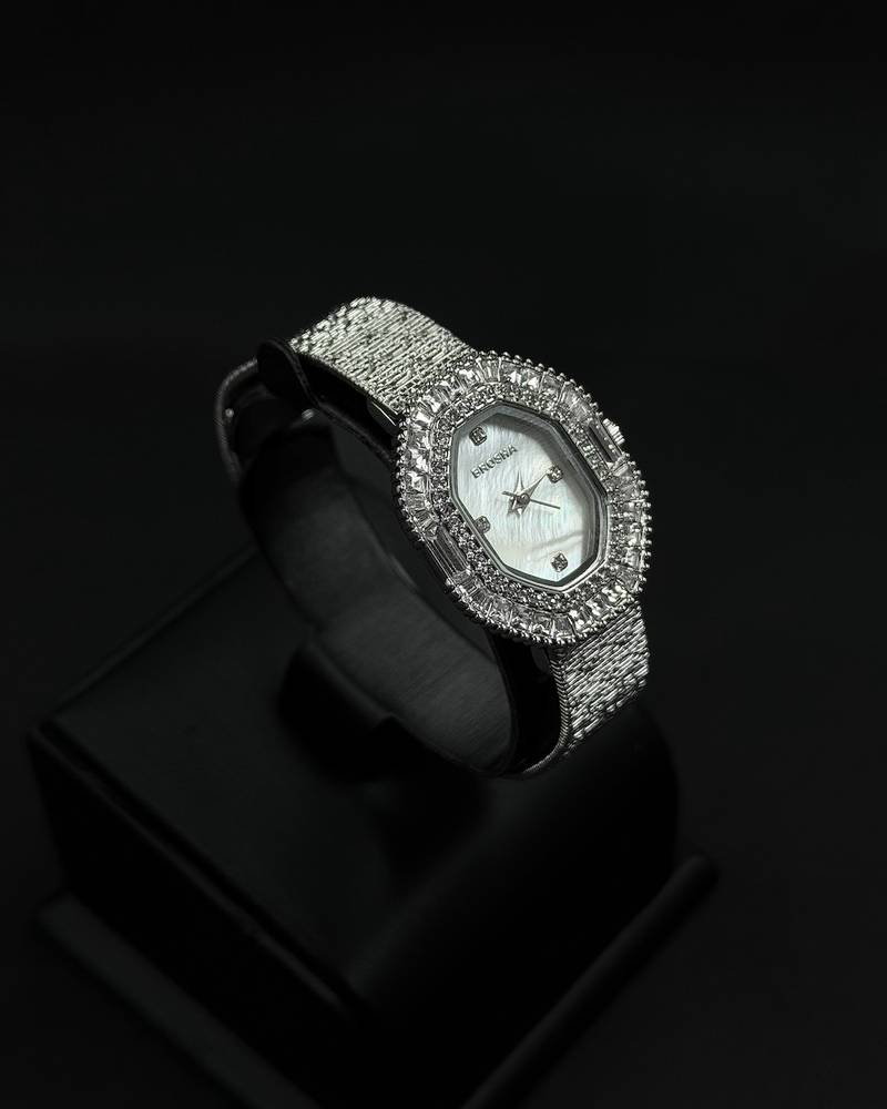 Womens watch with an oval bezel fully studded