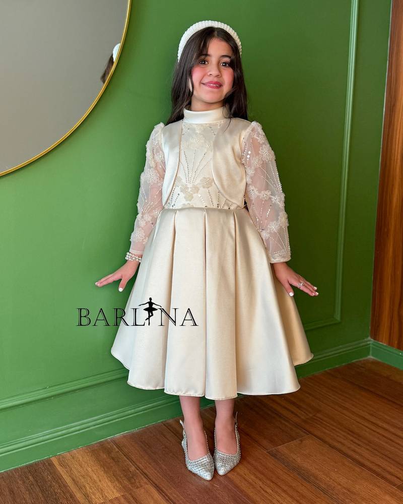 Beige girls' dress with sheer embroidered sleeves