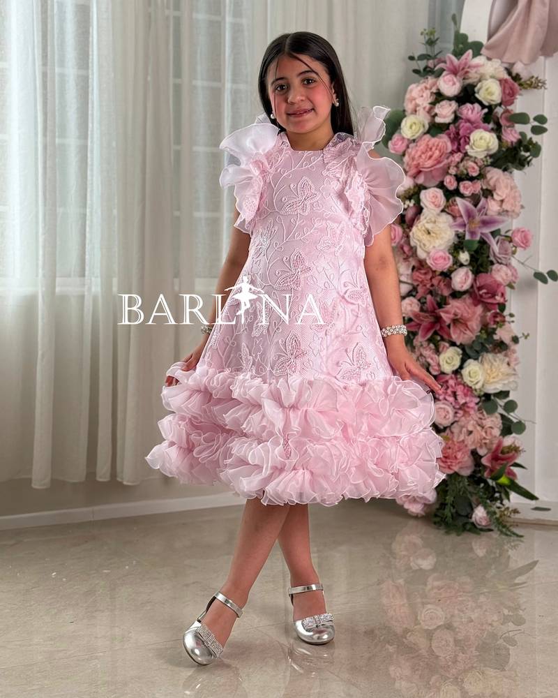 Girls' pink evening dress with a ruffled design