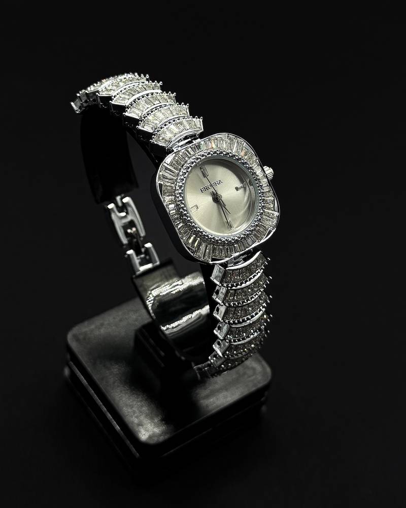 watch with a rounded square frame adorned with crystals