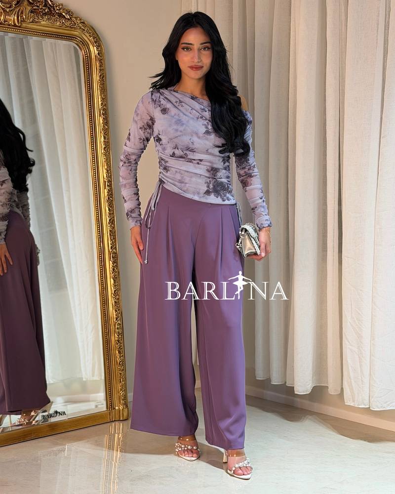 Set with purple pants and a gray floral top