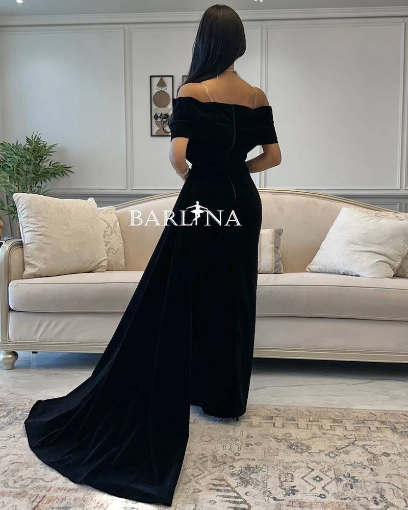 Black evening dress with side velvet tail