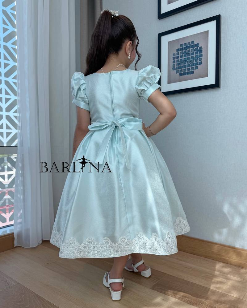 Light blue girly dress adorned with white lace trim