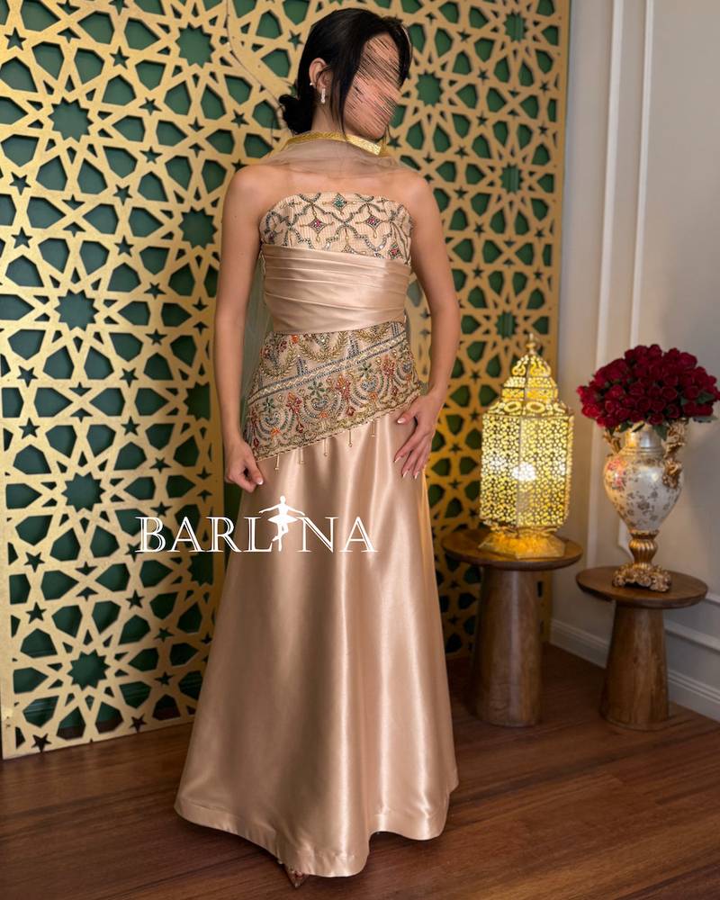 Gold evening dress with luxurious oriental embroidery