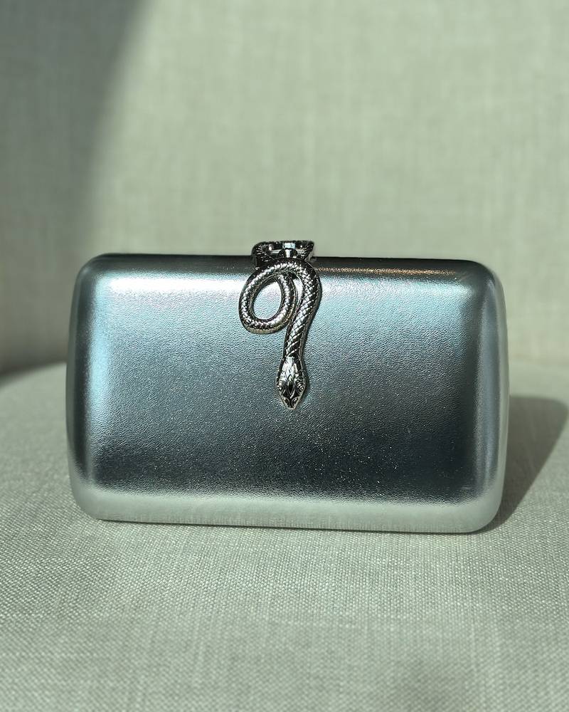 Clutch bag with metal snake lock