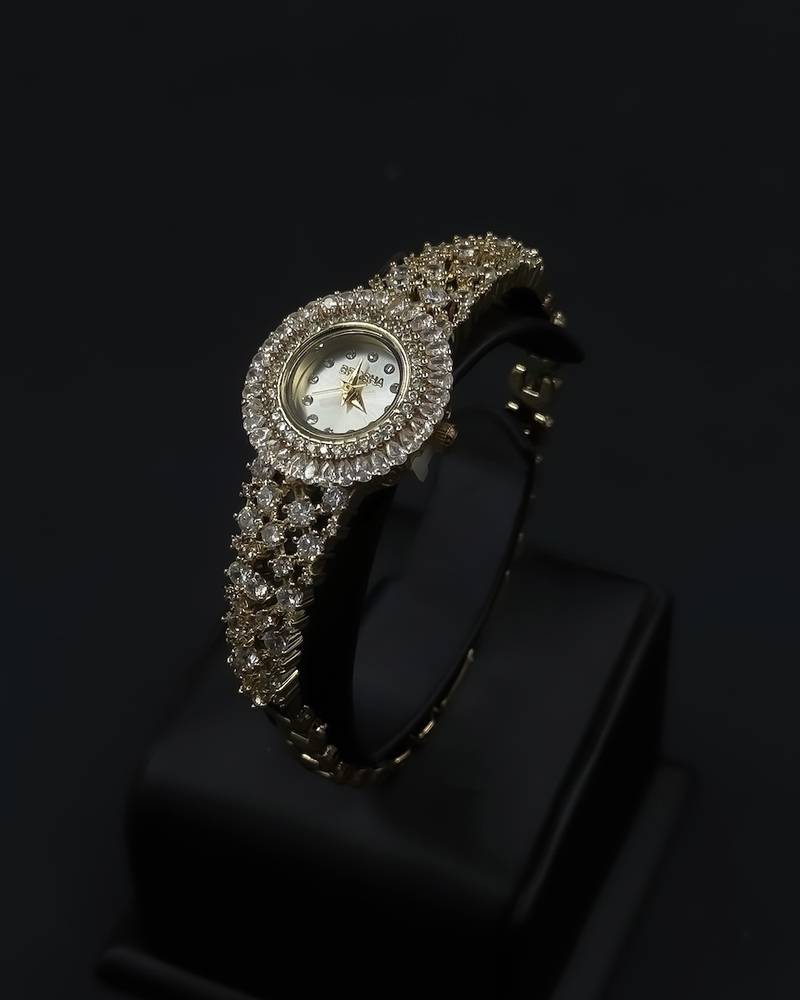 Women's watch with a round design and crystal embellishments