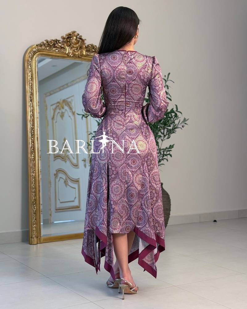 A purple patterned dress with an elegant tiered cut