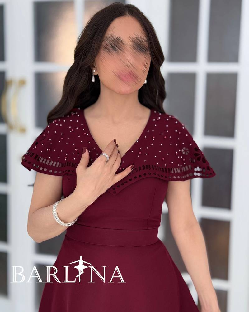 Burgundy dress with embroidery on the bodice and hem