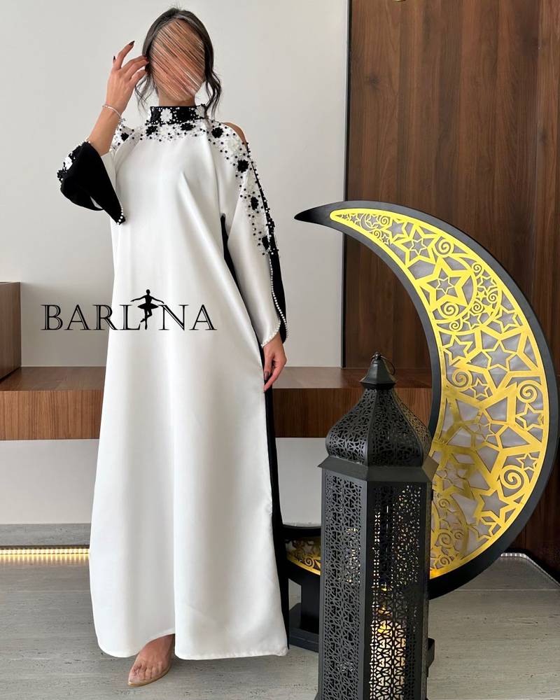 Black and white jalabiya with embroidery on the sleeves