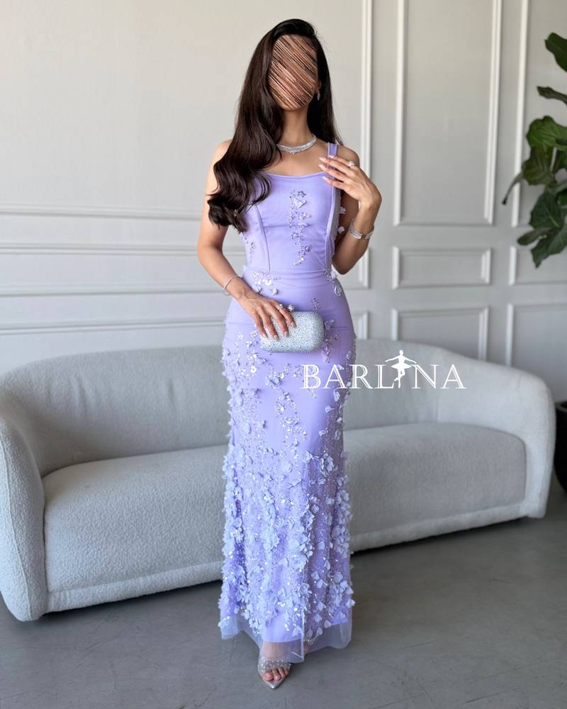 Long lavender-colored dress with floral embroidery