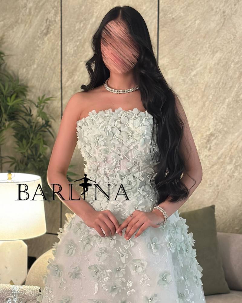 White dress with prominent rose embroidery
