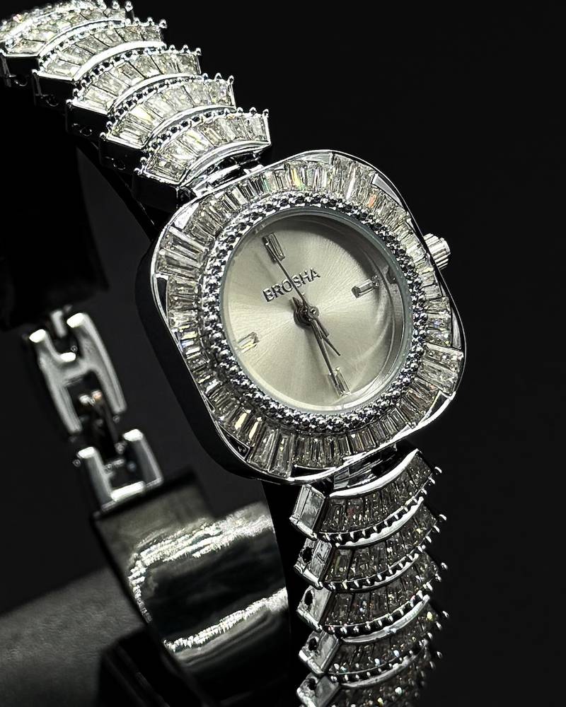 watch with a rounded square frame adorned with crystals