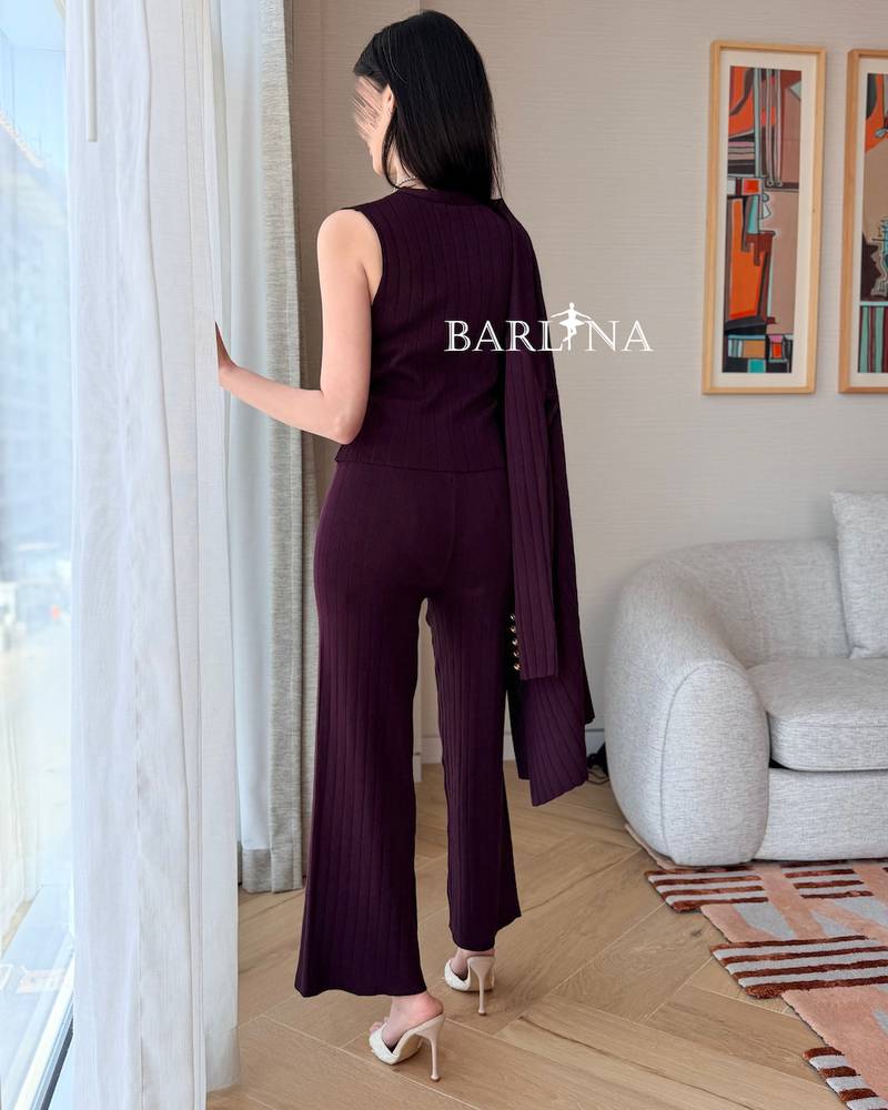 Burgundy formal suit with wide-leg trousers and a long jacket