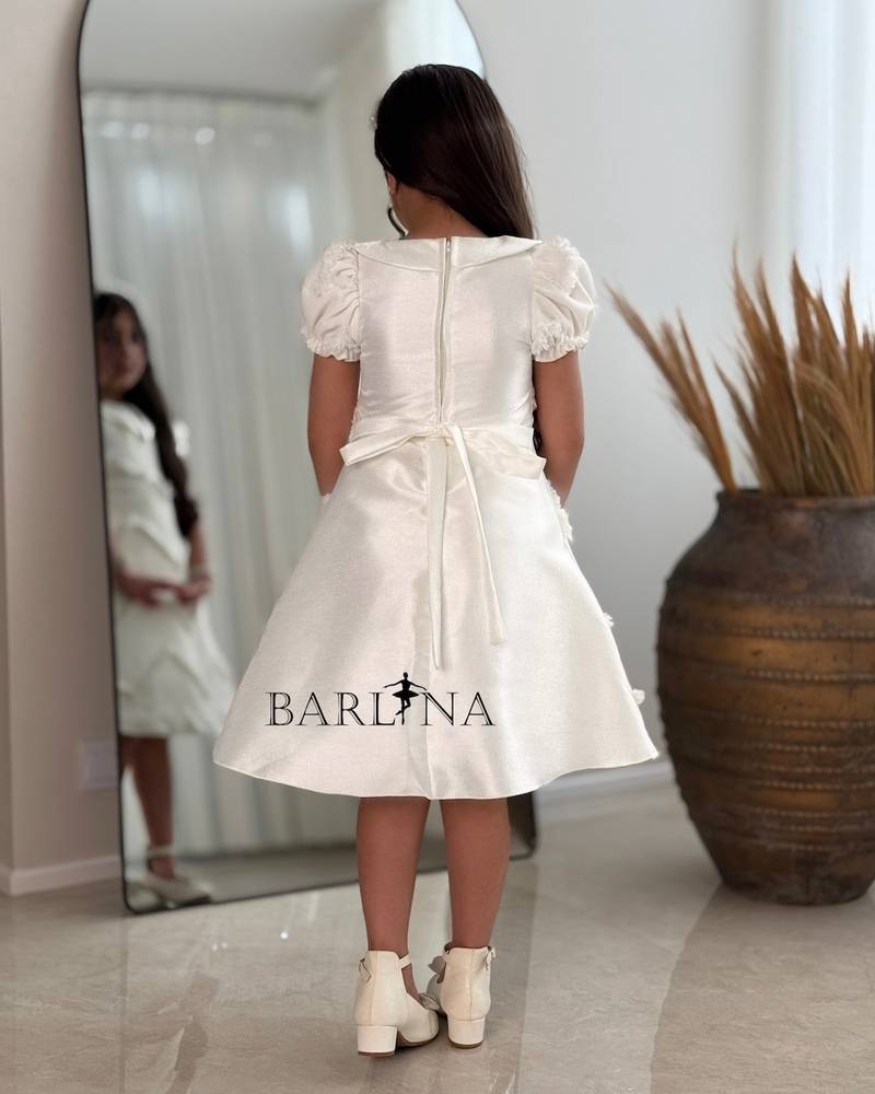 Off-white girls' dress with embroidered fabric