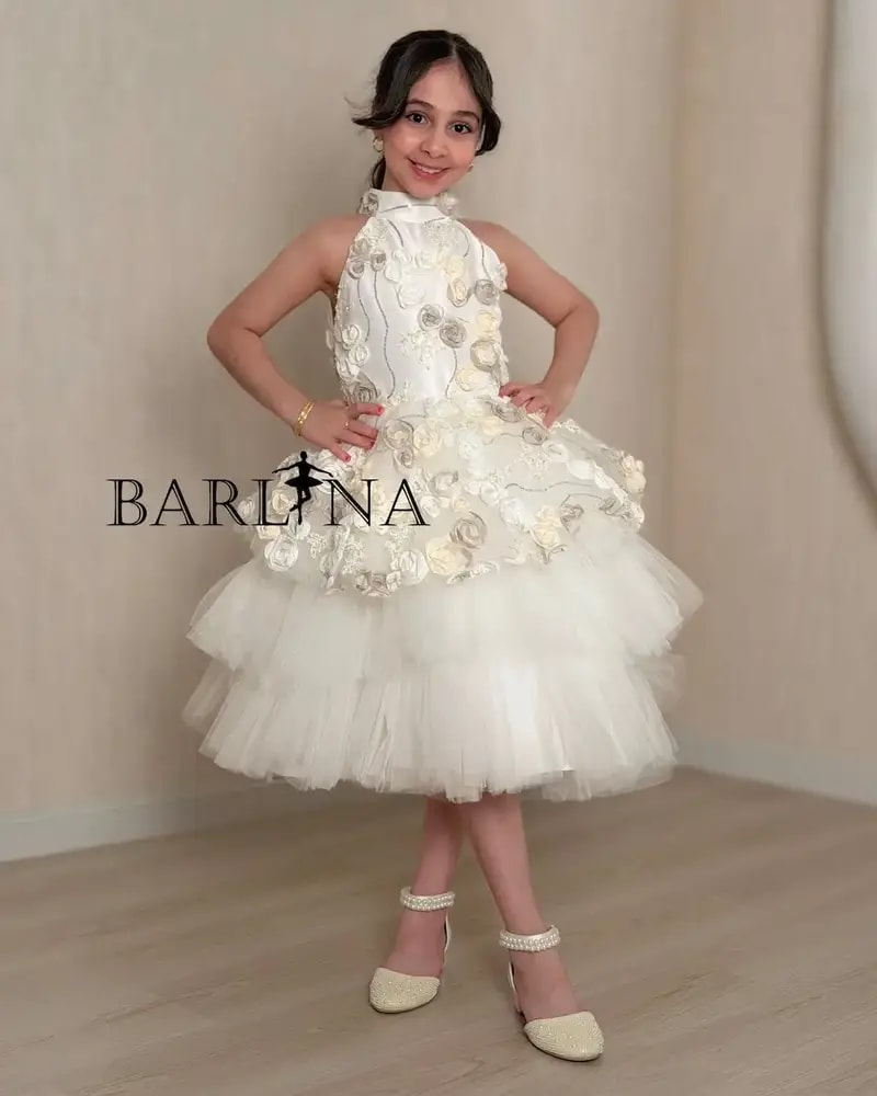 White girl's dress with prominent roses and fluffy tulle