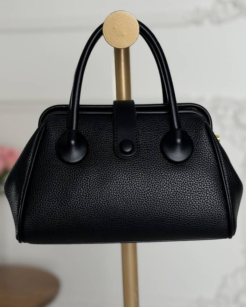 Handbag with a sleek design and stylish top handle