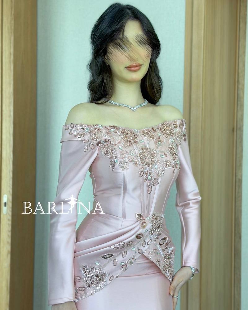 Elegant pink evening dress with a stylish train
