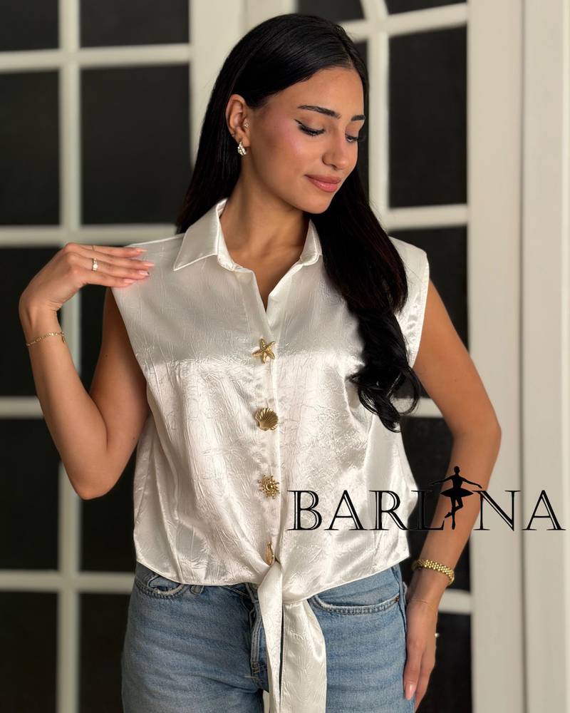 Elegant sleeveless blouse in a shiny color