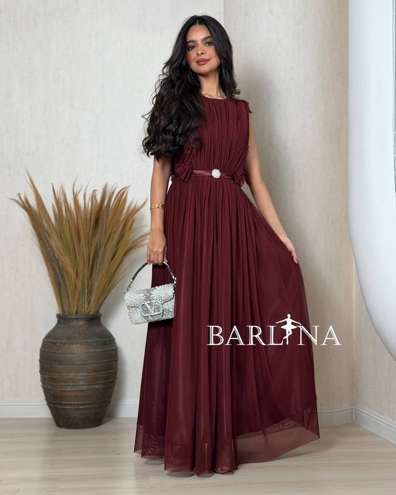Long burgundy dress with soft pleats
