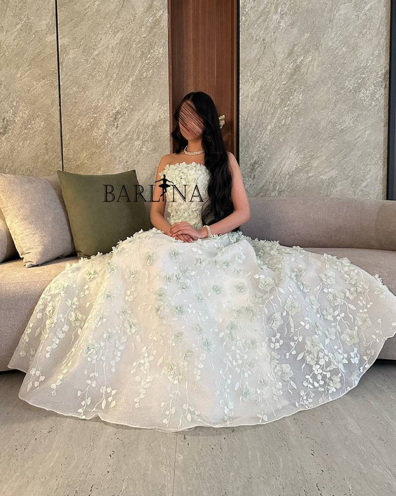 White dress with prominent rose embroidery
