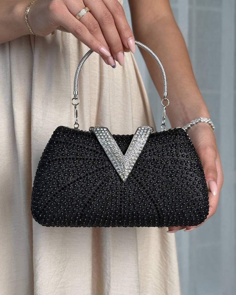 A luxurious occasion bag adorned with pearls and rhinestones