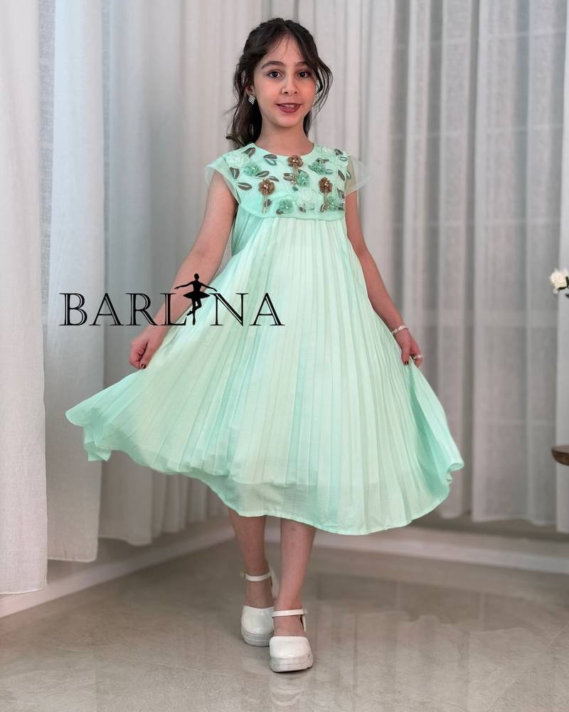 A soft girl's dress with floral embroidery