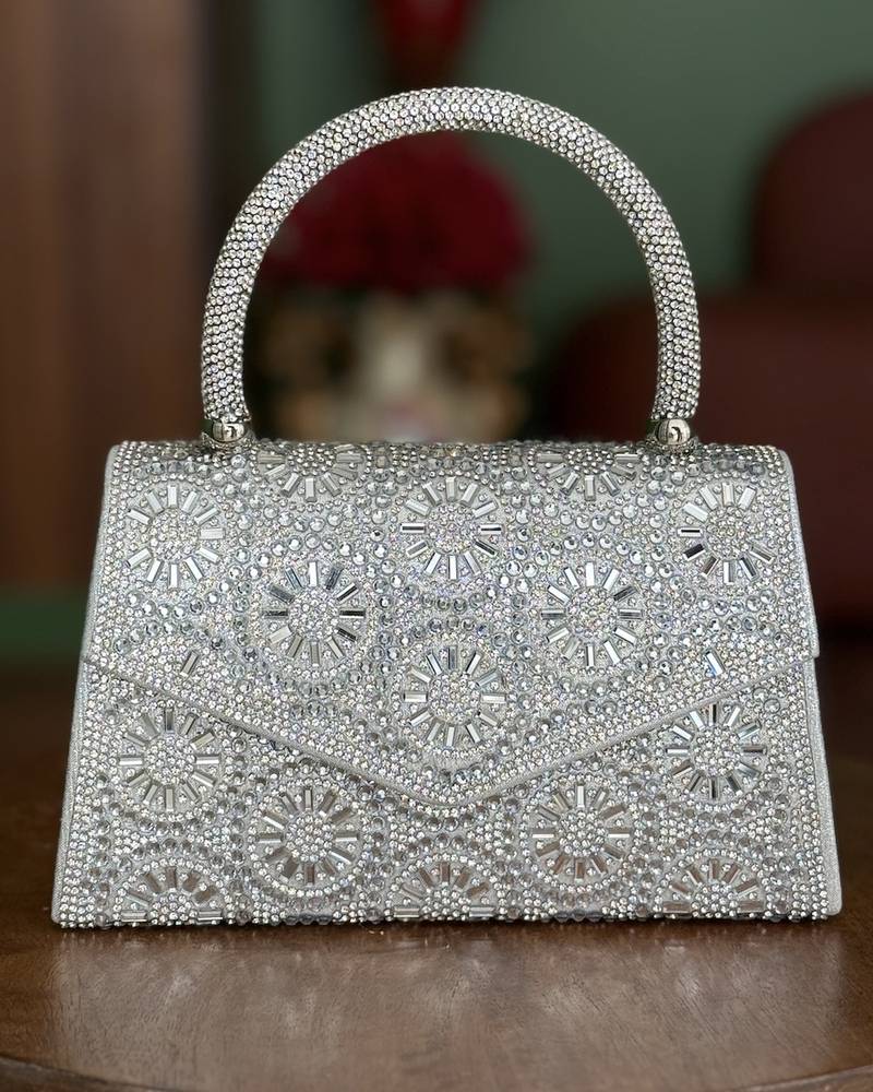A luxurious handbag covered in crystal beads