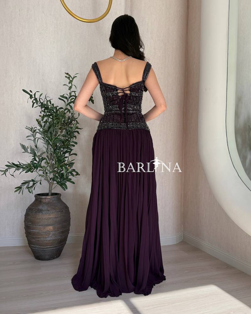 Elegant purple dress with heavy embroidery on the top