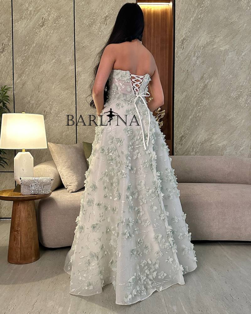 White dress with prominent rose embroidery