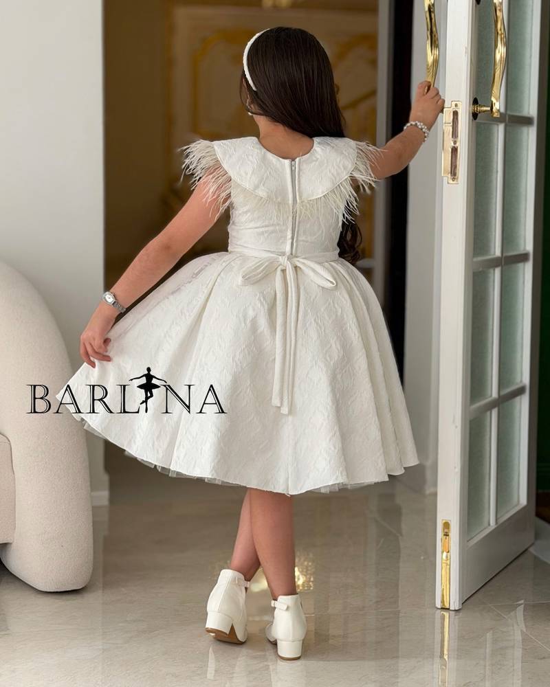 white girl's dress with a feather-trimmed collar
