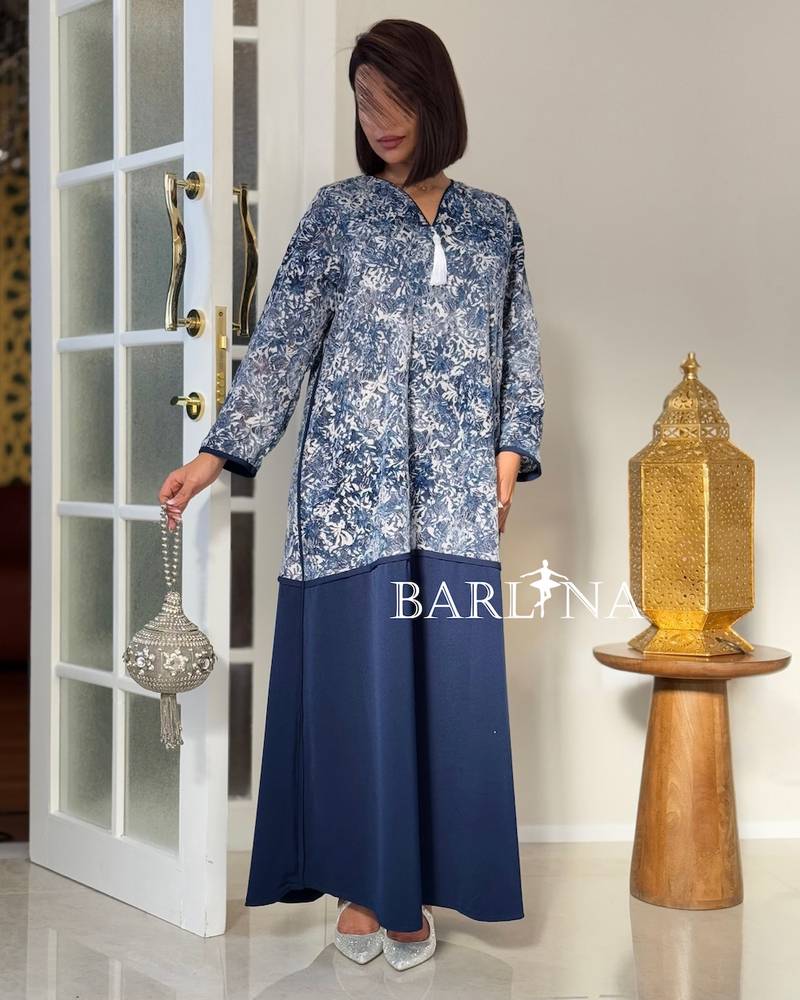 A wide navy blue jalabiya with delicate patterns