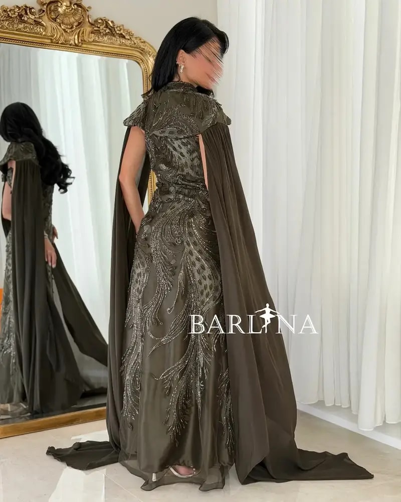 Dark brown dress with luxurious details and a cape