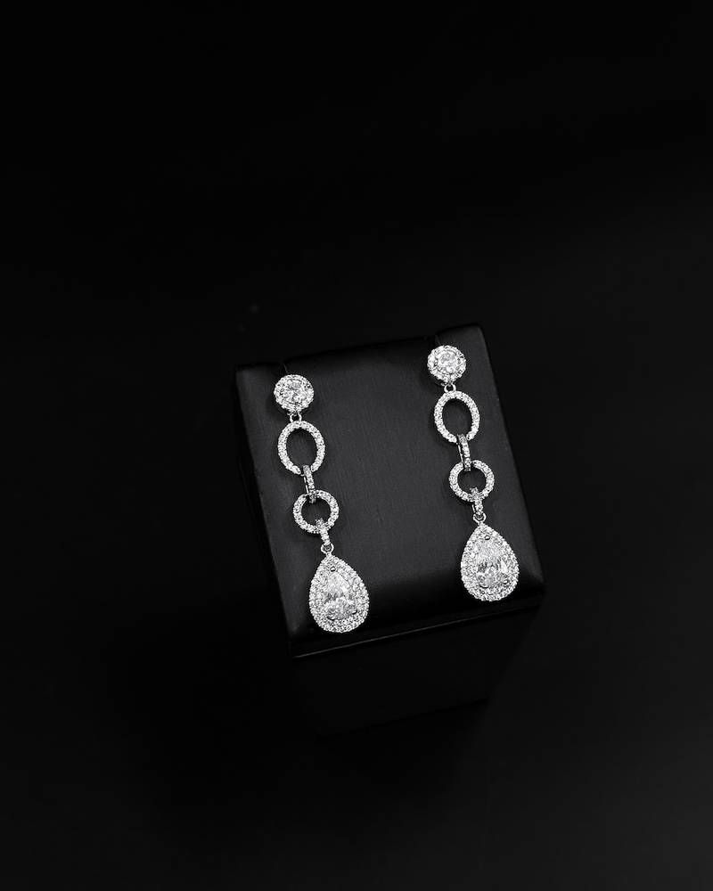 Long silver evening earrings