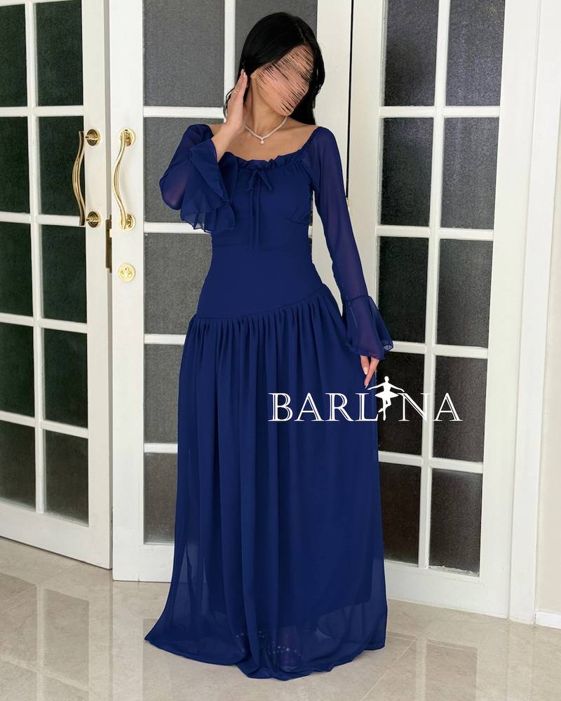 Soft blue dress with pleats and sheer sleeves
