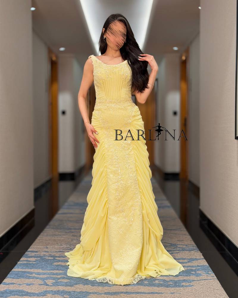Yellow evening dress with embroidered details
