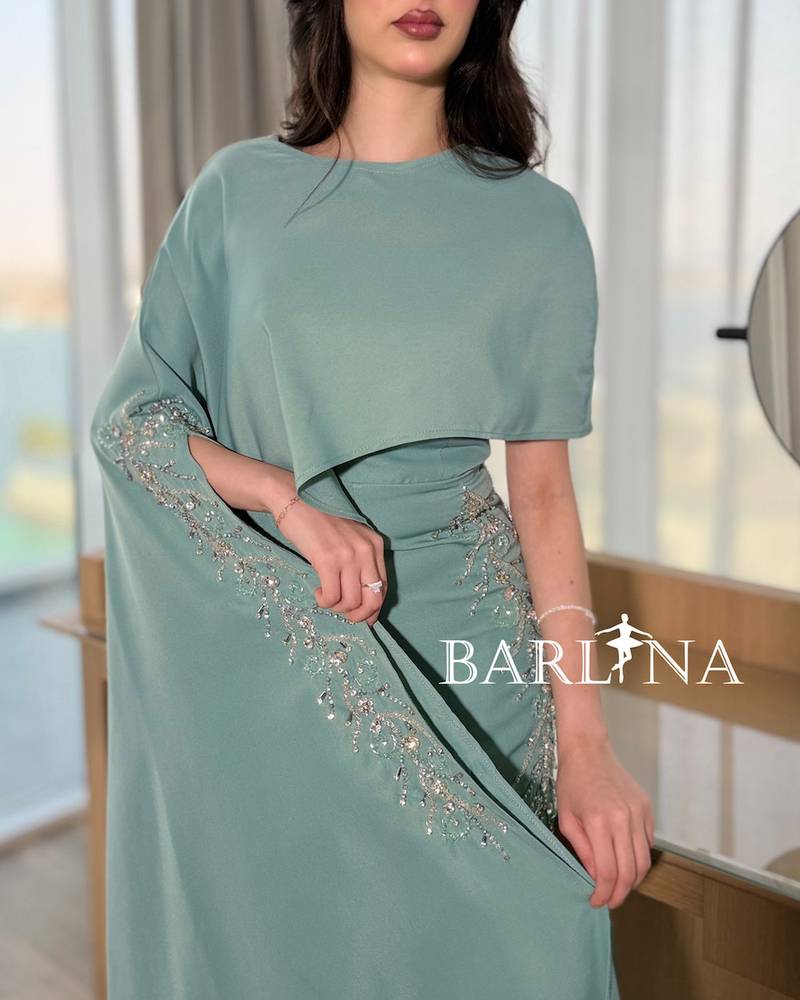 Tiffany jumpsuit with a side cape and shimmering embroidery