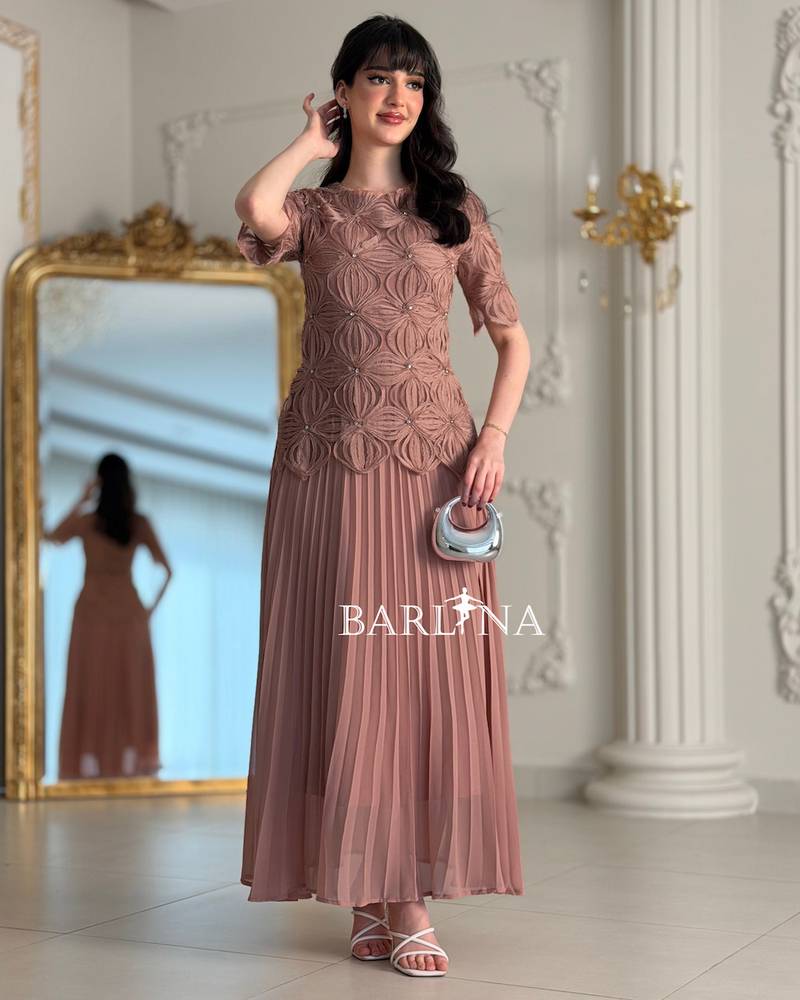 Soft pleated dress with embroidered bodice