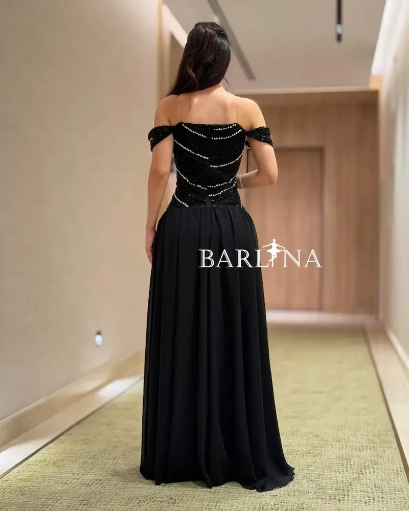 Elegant black evening dress adorned with sparkling stripes