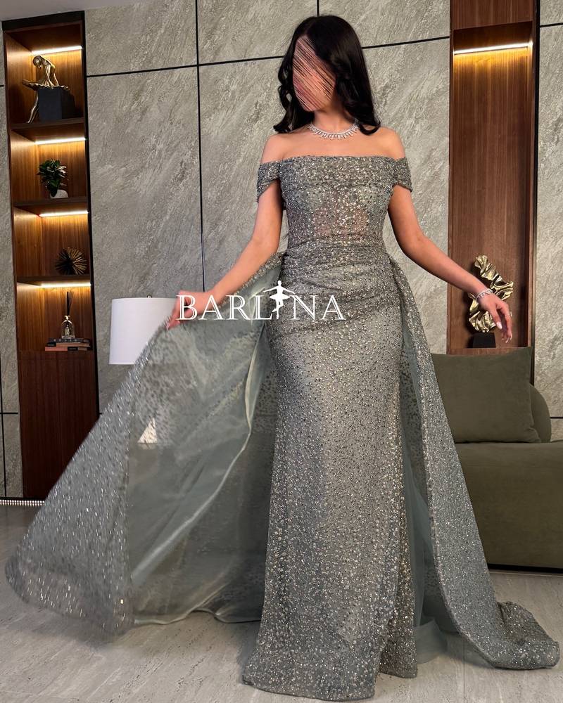 Luxurious evening dress with a beaded back train