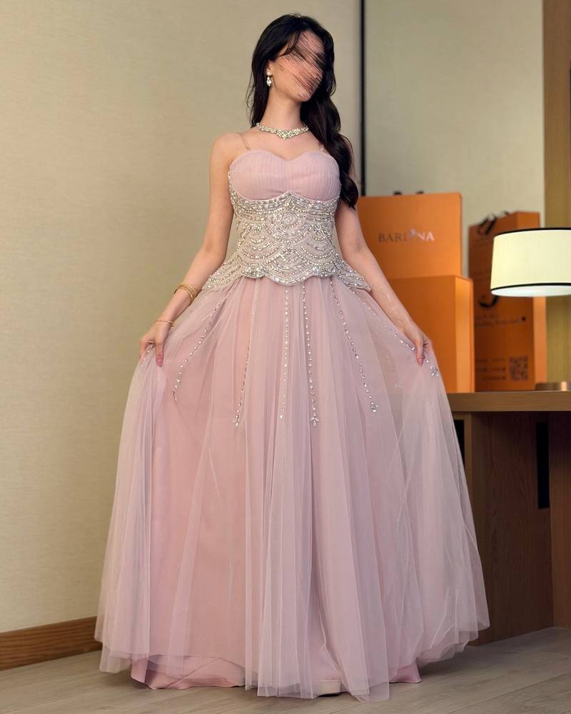 Nude tulle evening dress with a beaded corset
