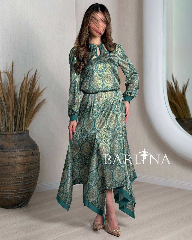 Long green floral suit with an asymmetric cut