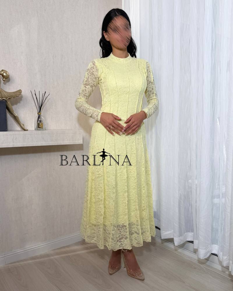 Soft yellow lace dress with long sleeves