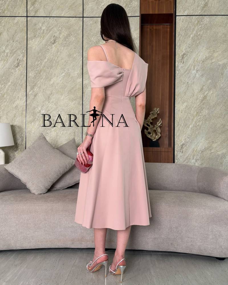 Light pink midi dress with a defined waist